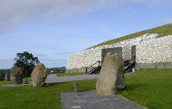 Newgrange Passage Tomb with 4 of the existing 12 standing stones.