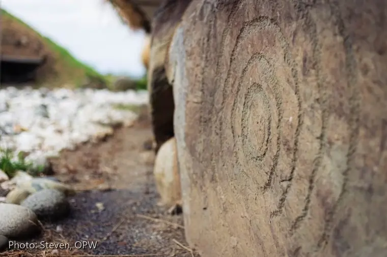 Knowth Kerbstone K69 close-up of the double concentric circle enclosed by four gapped circles opening downwards.