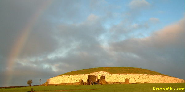 The white quartz stone illuminated by the winter solstice sunrise with a rainbow to complete a wonderful spectacle