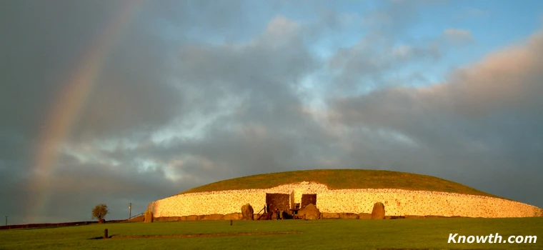 The white quartz stone illuminated by the winter solstice sunrise with a rainbow to complete a wonderful spectacle